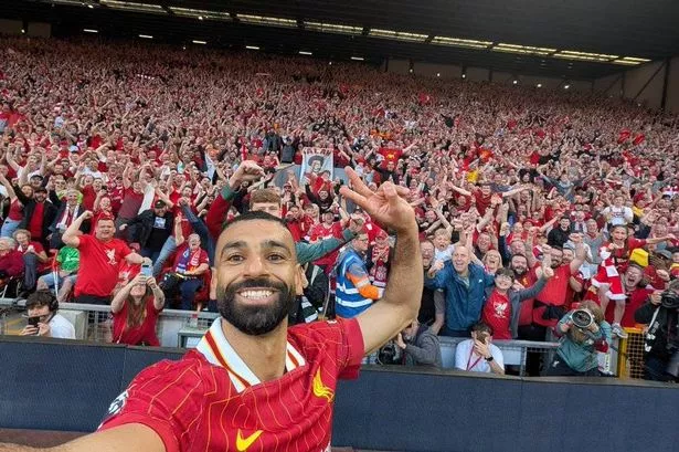 Mo Salah taking a selfie at Anfield.