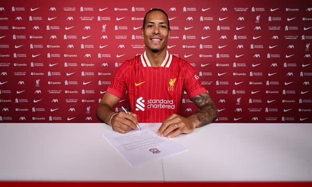 Virgil van Dijk signing a new Liverpool contract.